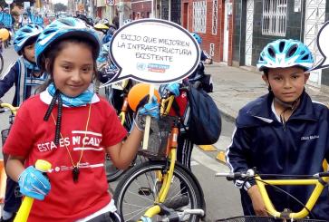 Kids participating in a safe streets event on Camilo Cardona