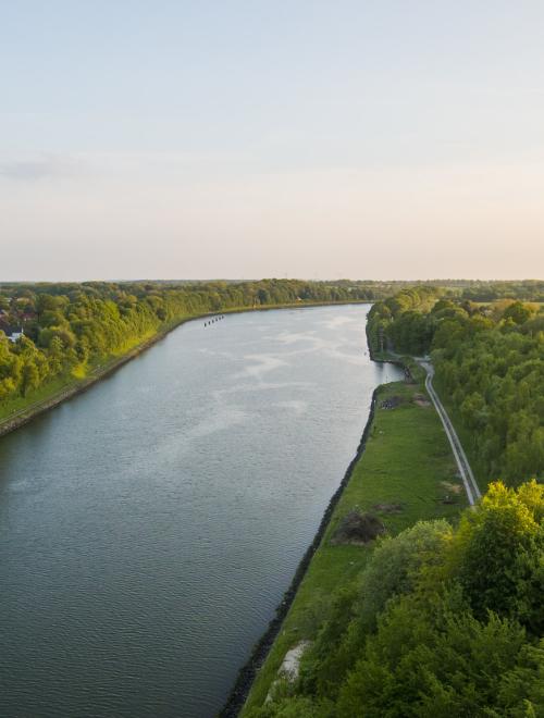 Sunset, water and trees from Kiel Canal Bridge.