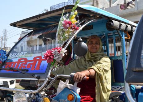 Woman in vehicle with flowers