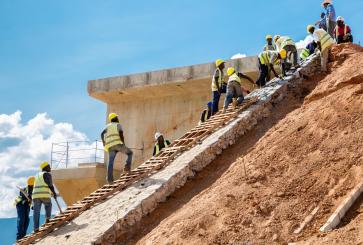 Men working on the embankments of the Nairobi to Mombasa section of the China funded Standard Gauge Railway Project in Kenya